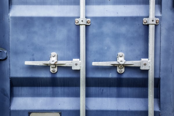 Blue metal door on a large shipping container